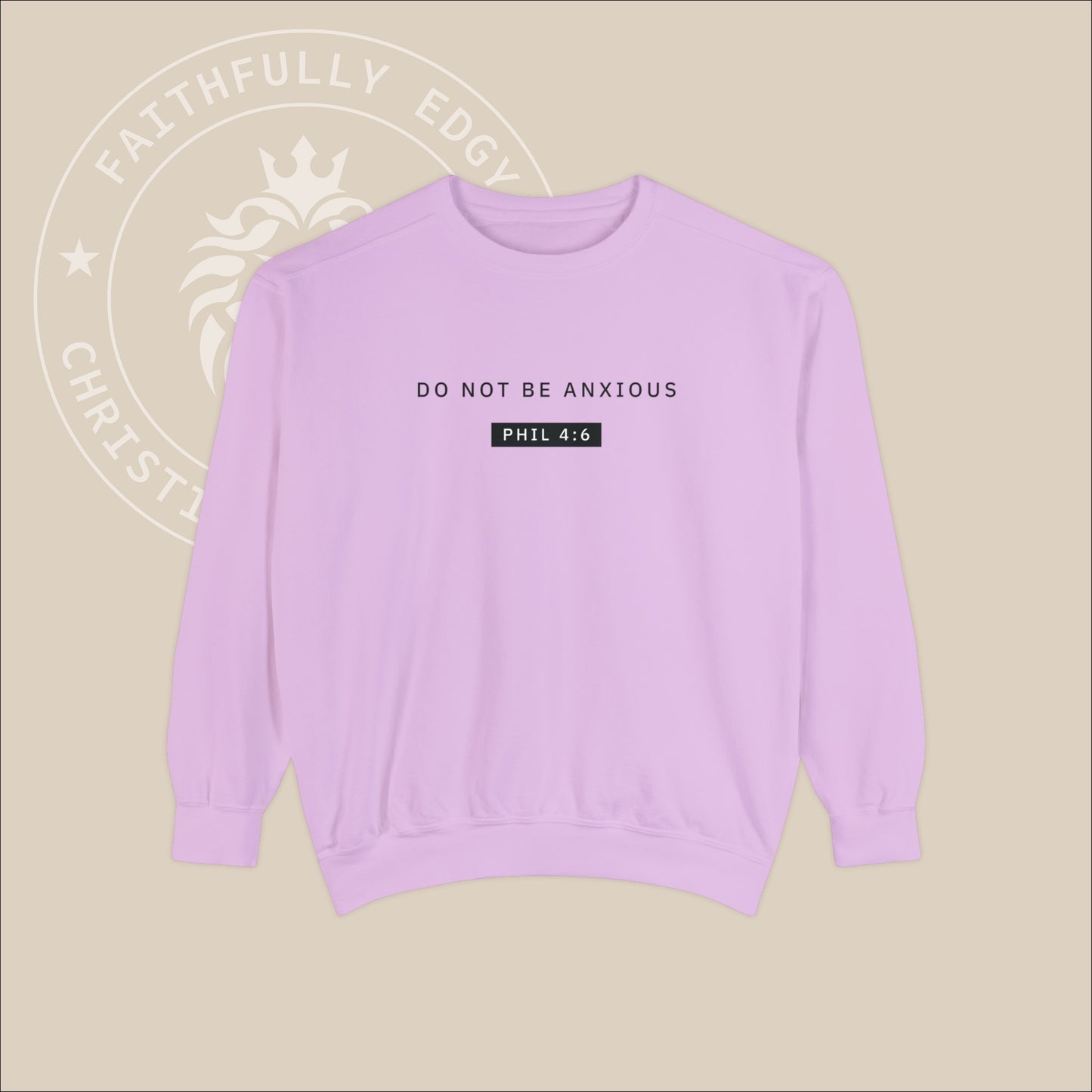 Lilac crewneck sweater with black "Do not be anxious" print. 