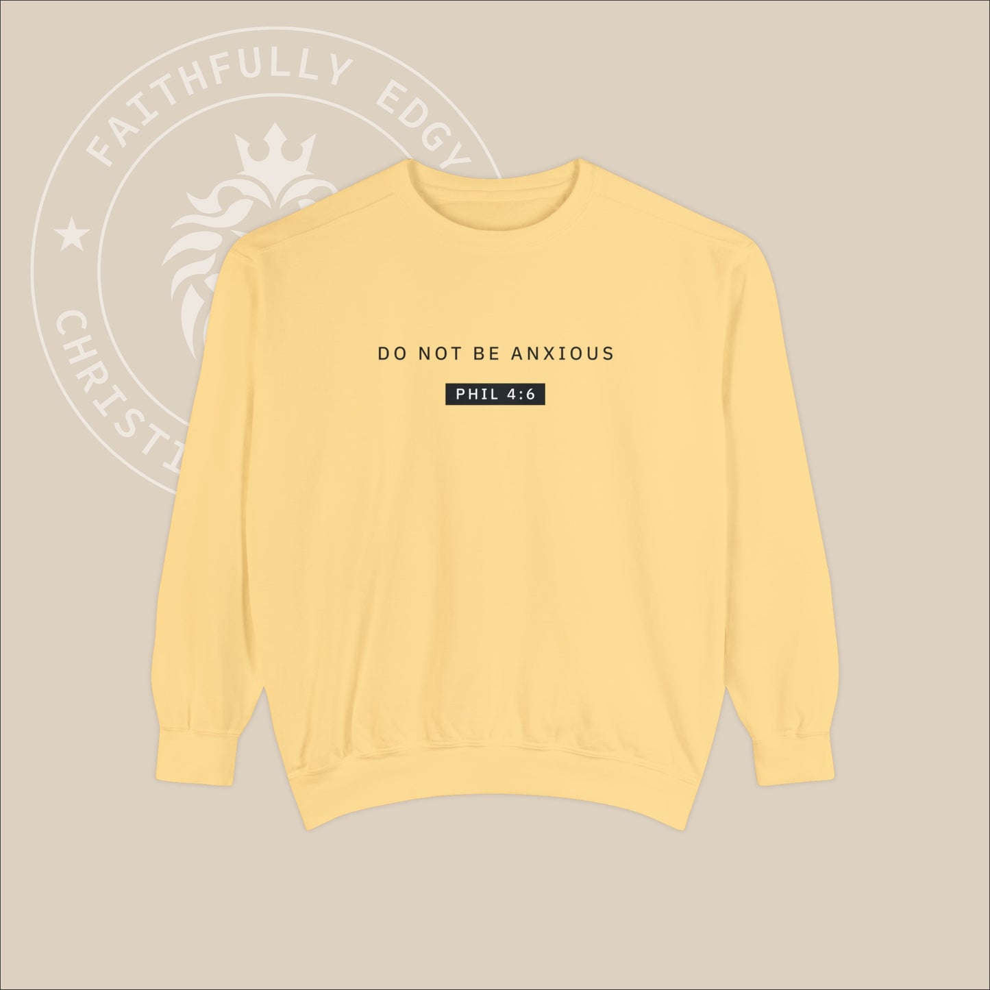 Yellow crewneck sweater with black "Do not be anxious" print. 