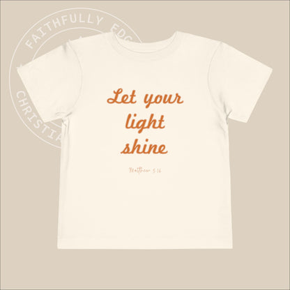 Toddler "Let Your Light Shine" Tee, Matt 5:16 encourages believers to shine their light through good deeds, glorifying God and inspiring all.