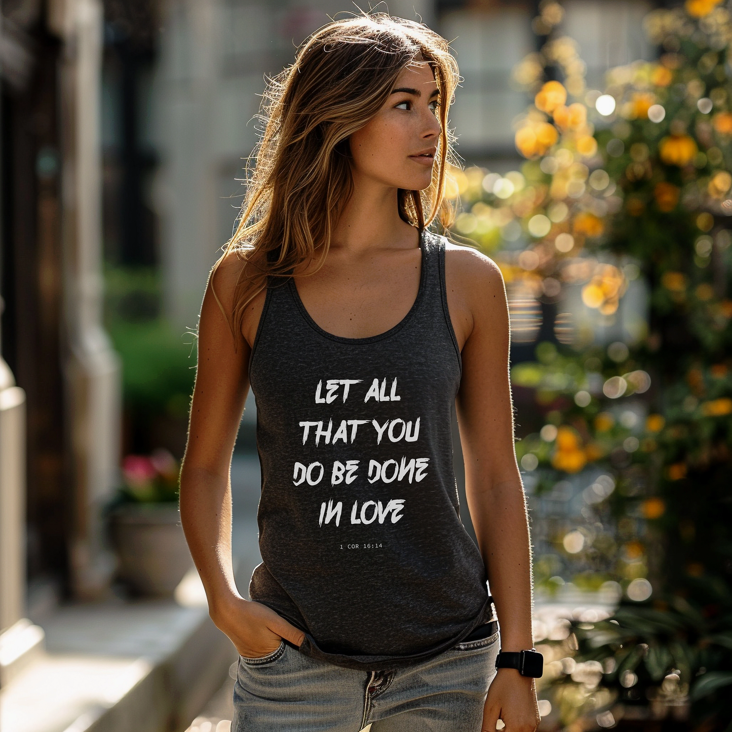 Grey unisex tank top with white "Let all that you do be done in love" print. 