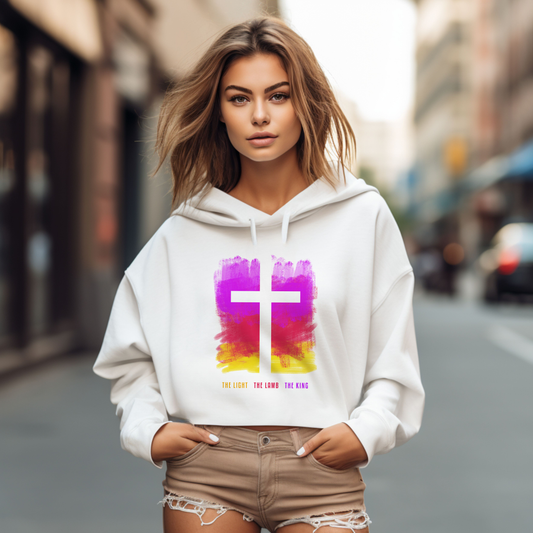 Women's "The Light, The Lamb, The King" Cropped Hoodie. Jesus is the Light of the world, our Savior on the cross, and King over all.