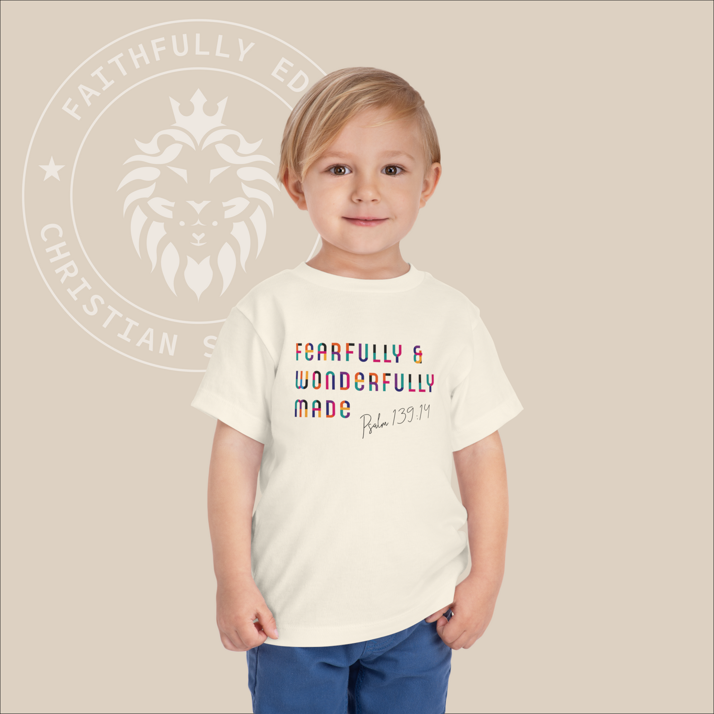 Neutral toddler tee with rainbow colored "Fearfully & Wonderfully Made" print. 