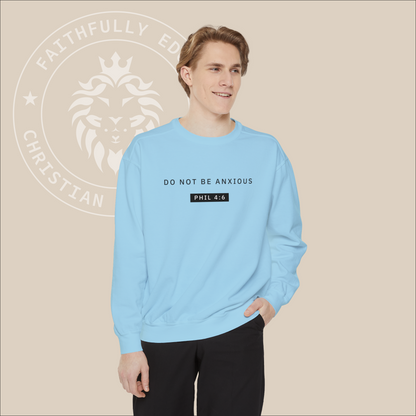 Light blue crewneck sweater with black "Do not be anxious" print. 