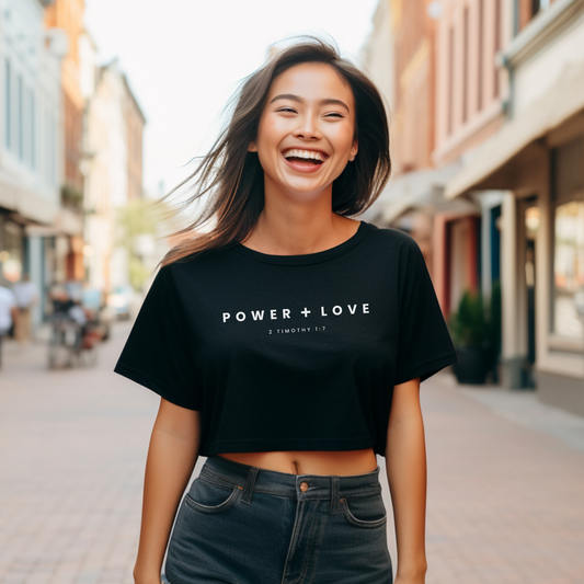 Women's "Power + Love" Crop Tee with 2 Tim. 1:7 print, reminding us God gives us power, love, and a sound mind, not a spirit of fear.